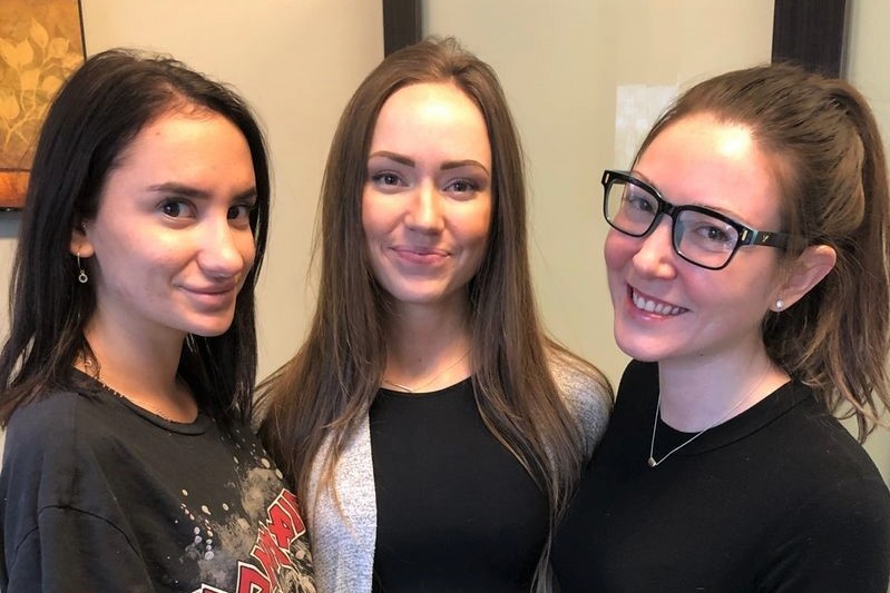 Medical aesthetics practitioner Crystal Lewis RN with two patients